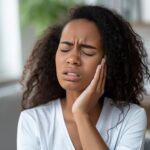 Stockcake toothache discomfort expression 1751406130